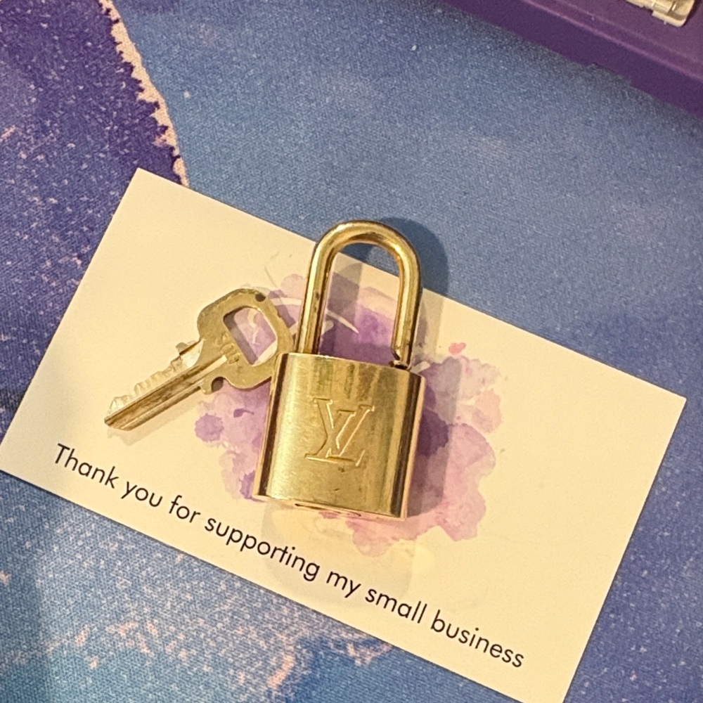 Louis Vuitton Gold Padlock and Key Set (300)